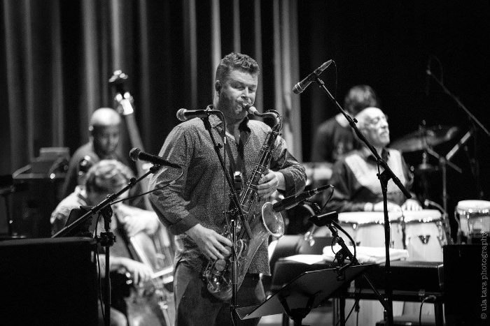 Saxophonist James Arben and his white Syos tenor saxophone mouthpiece Saxophonist James Arben and his white Syos tenor saxophone mouthpiece