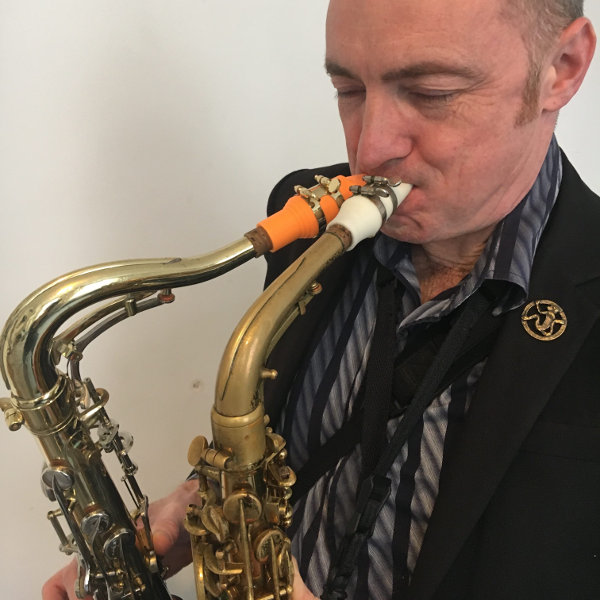 Terry Edwards and his Syos white and orange mouthpieces for alto and tenor saxophones Terry Edwards and his Syos white and orange mouthpieces for alto and tenor saxophones