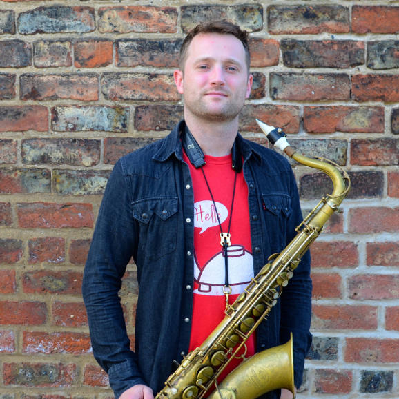 The saxophonist Andrew Cow Scott and his white tenor Syos mouthpiece