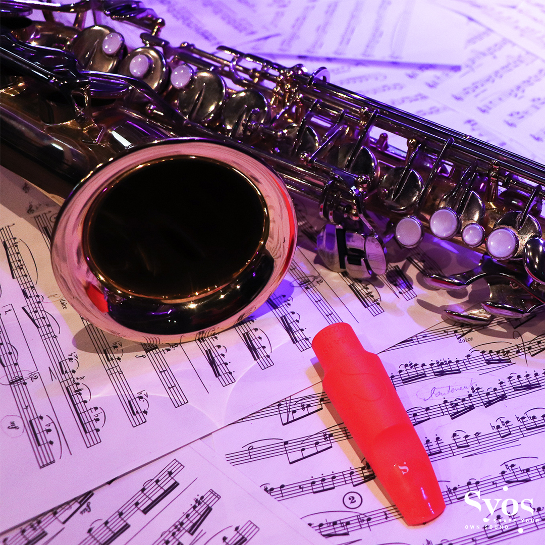 Saxophone, mouthpiece and score sheet